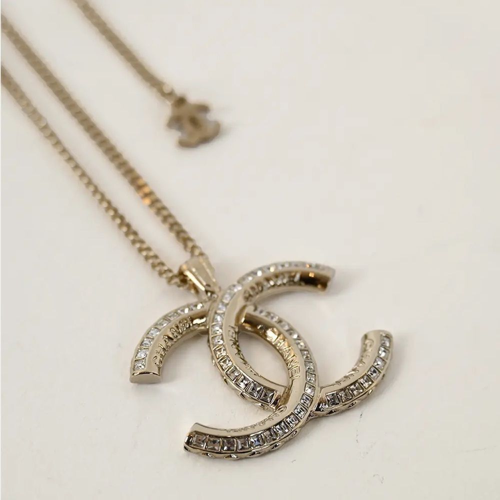 CHANEL Multi Logo Engraved Gold Crystal CC Pendant Necklace